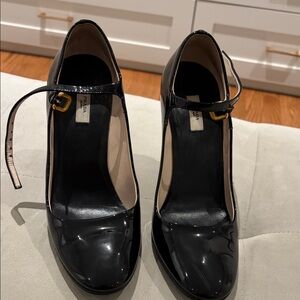 Prada Black Patent Mary Jane Heels with Gold Buckle